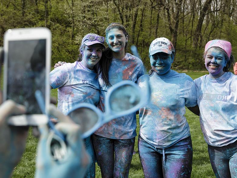 Students pose for picture after running the ROY G BIV Memorial Run